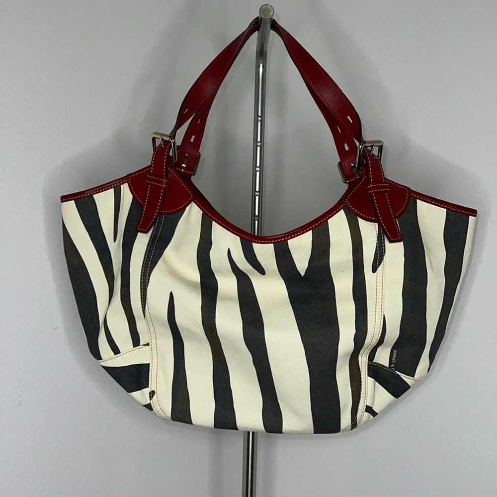 Dooney & Bourke Zebra Print Tote with Red Accents
In pristine condition. - Picture 2 of 8